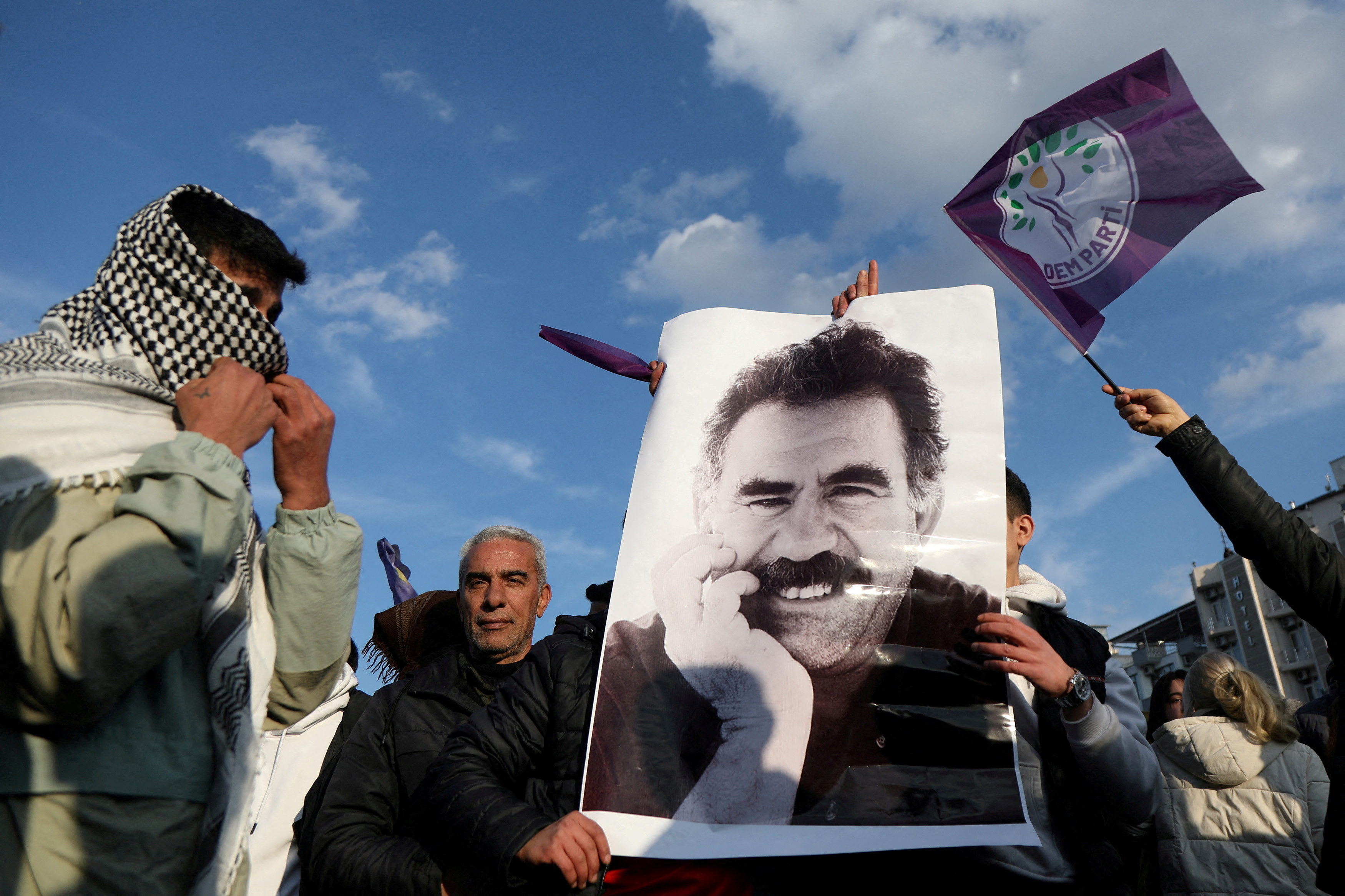 FILE PHOTO: FILE PHOTO: A demonstrator holds a picture of jailed Kurdish militant leader Ocalan