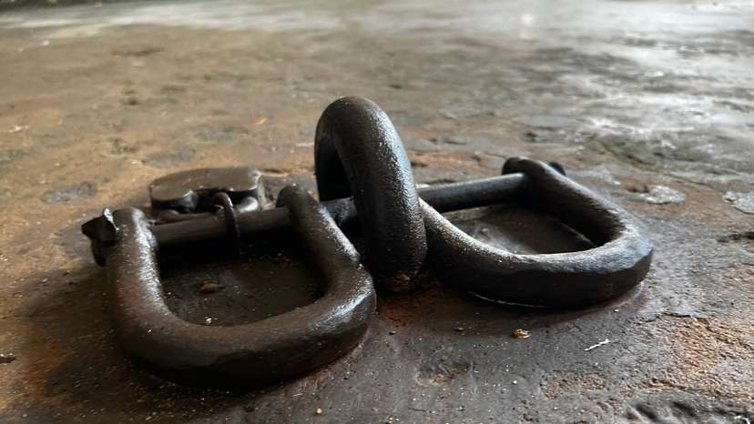 Ankle shackles used during the transatlantic slave trade at Fort Prinzenstein in Keta, Ghana on Aug 8, 2022. THOMSON REUTERS FOUNDATION/Nita Bhalla