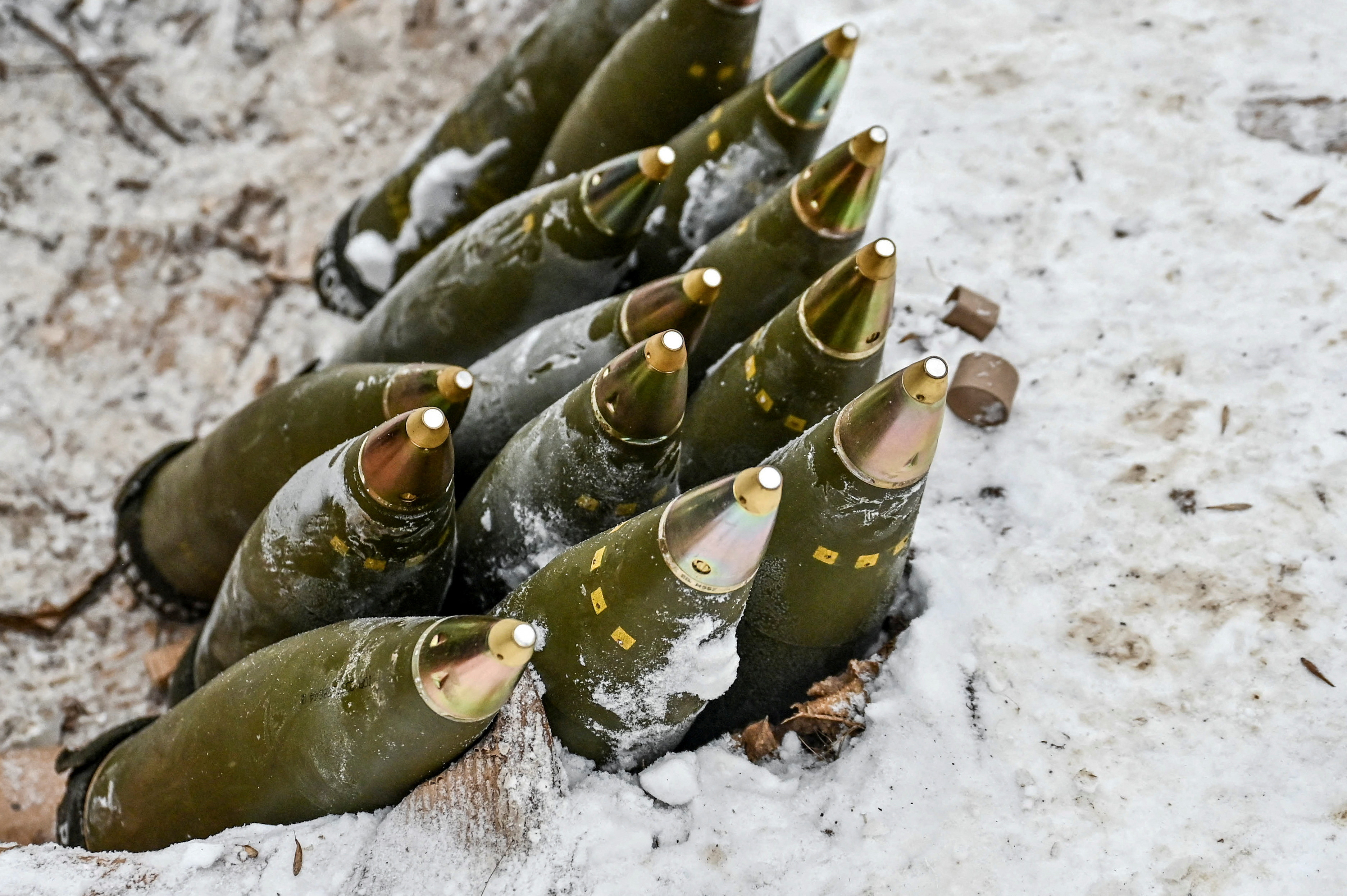FILE PHOTO: 155-mm artillery shells are placed in a pile at a position of Ukrainian servicemen near a front line in Zaporizhzhia region