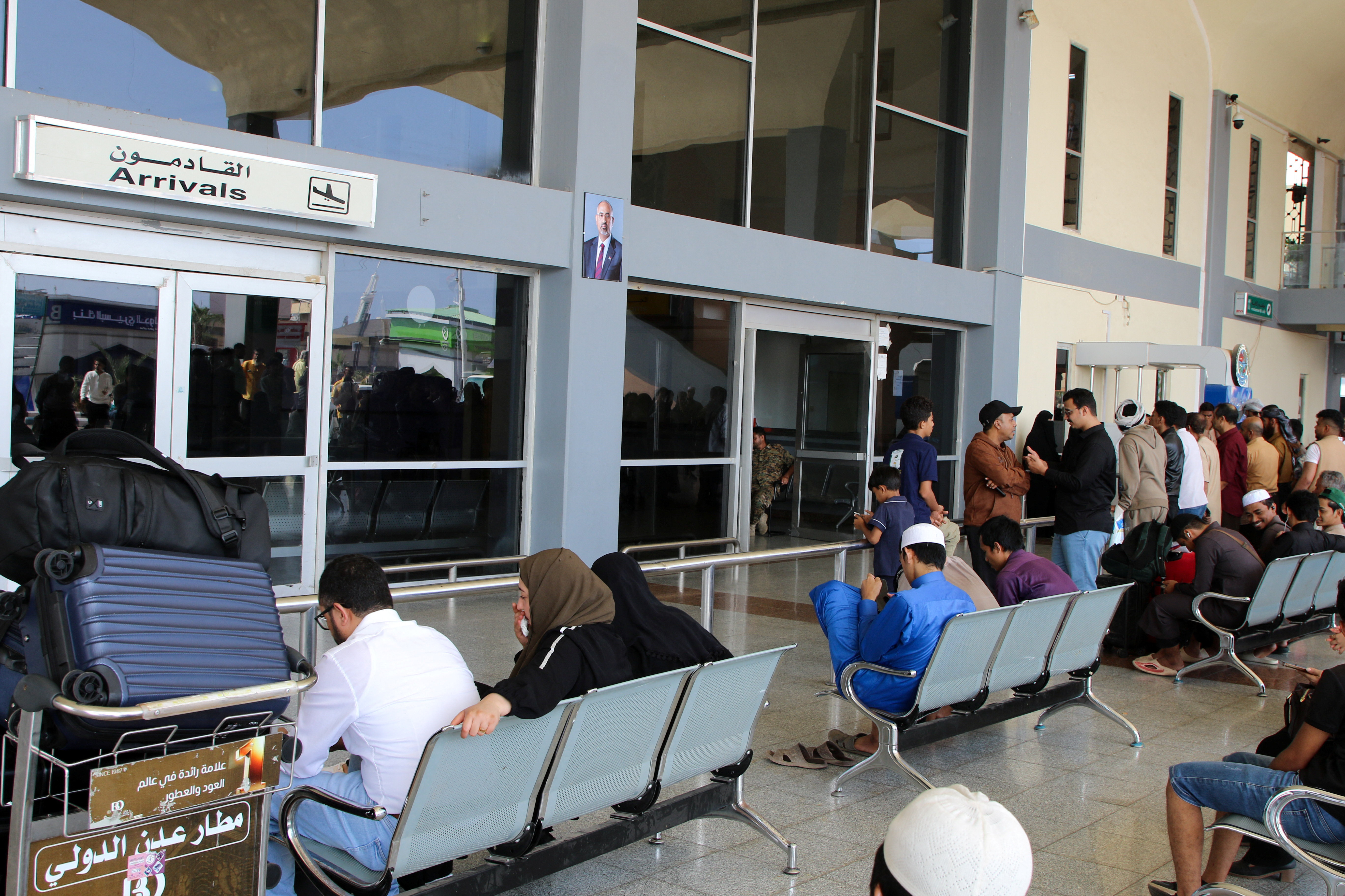 Passengers wait for their flights at Aden Airport in Aden