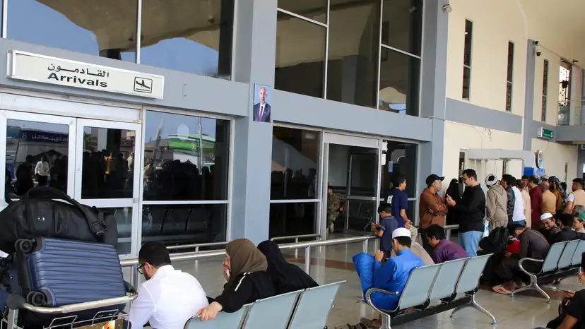 Passengers wait for their flights at Aden Airport in Aden