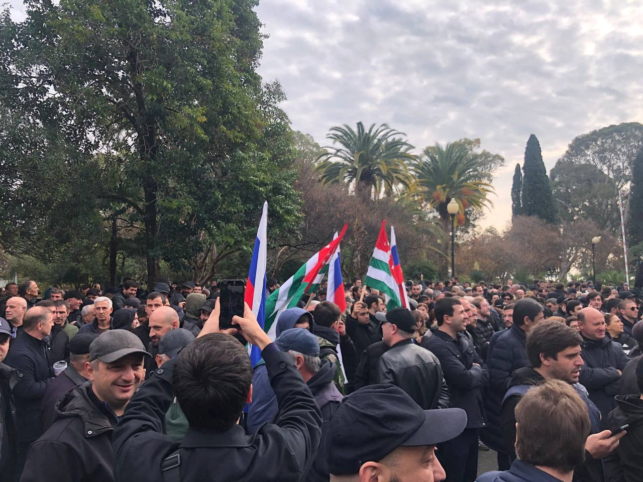 Protesters rally outside the parliament building in the capital of Georgia's breakaway region of Abkhazia