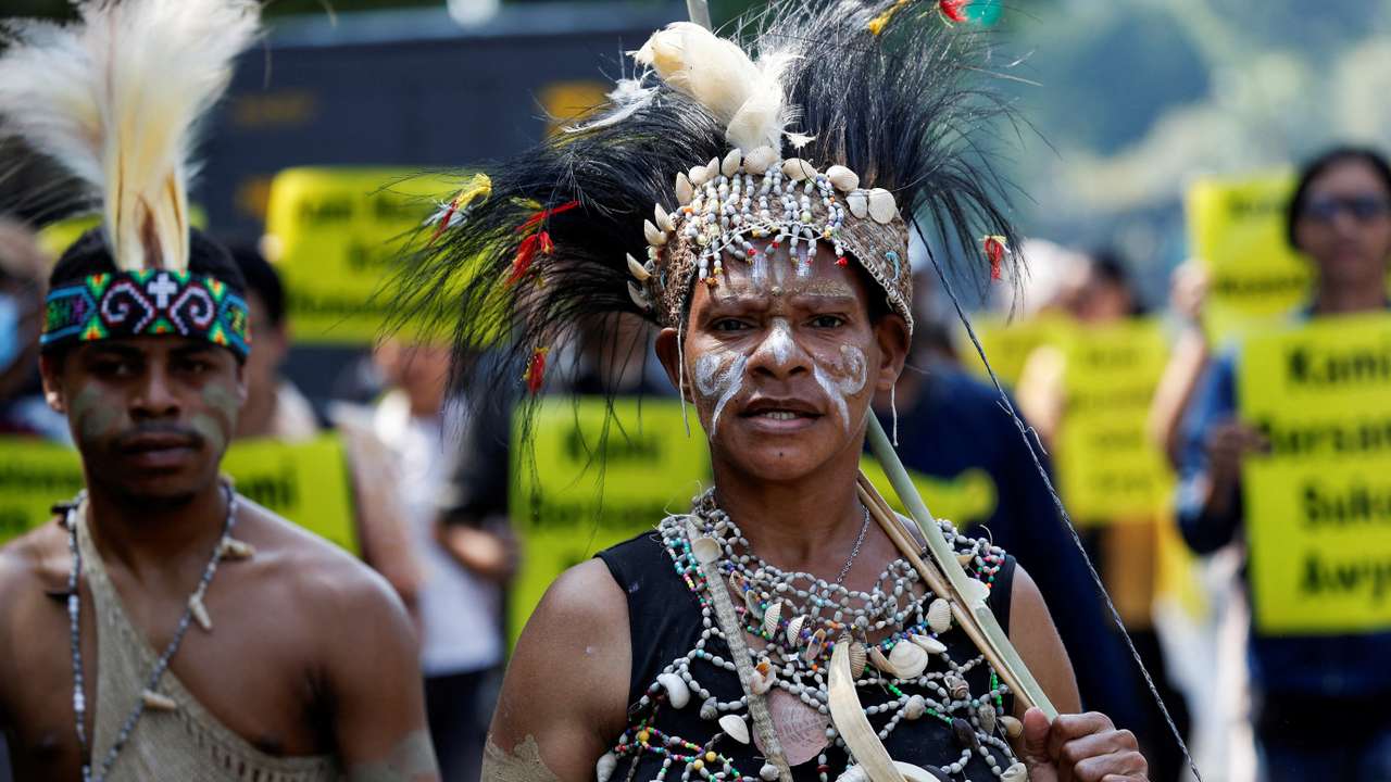 FILE PHOTO: Protest against deforestation in indigenous Papuans' land, outside the country's Supreme Court in Jakarta