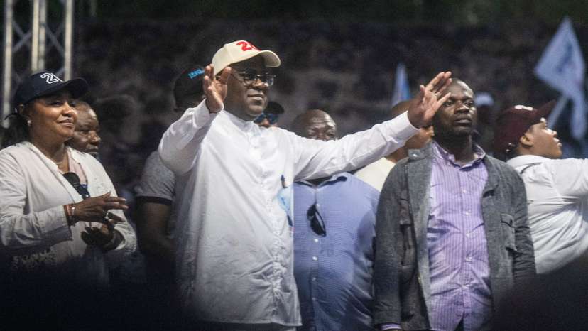 FILE PHOTO: Democratic Republic of the Congo's President Felix Tshisekedi flanked by first lady Denise Nyakeru salute supporters during a campaign rally at the Afia stadium in Goma
