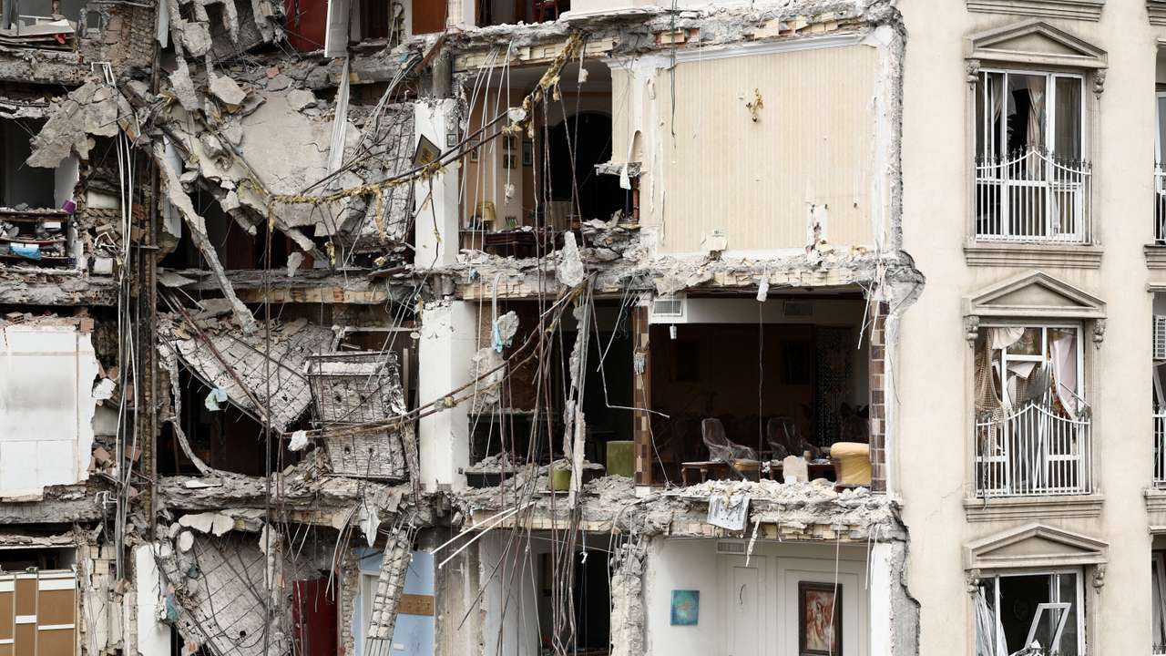 A view of a residential building damaged by a strike, Tehran