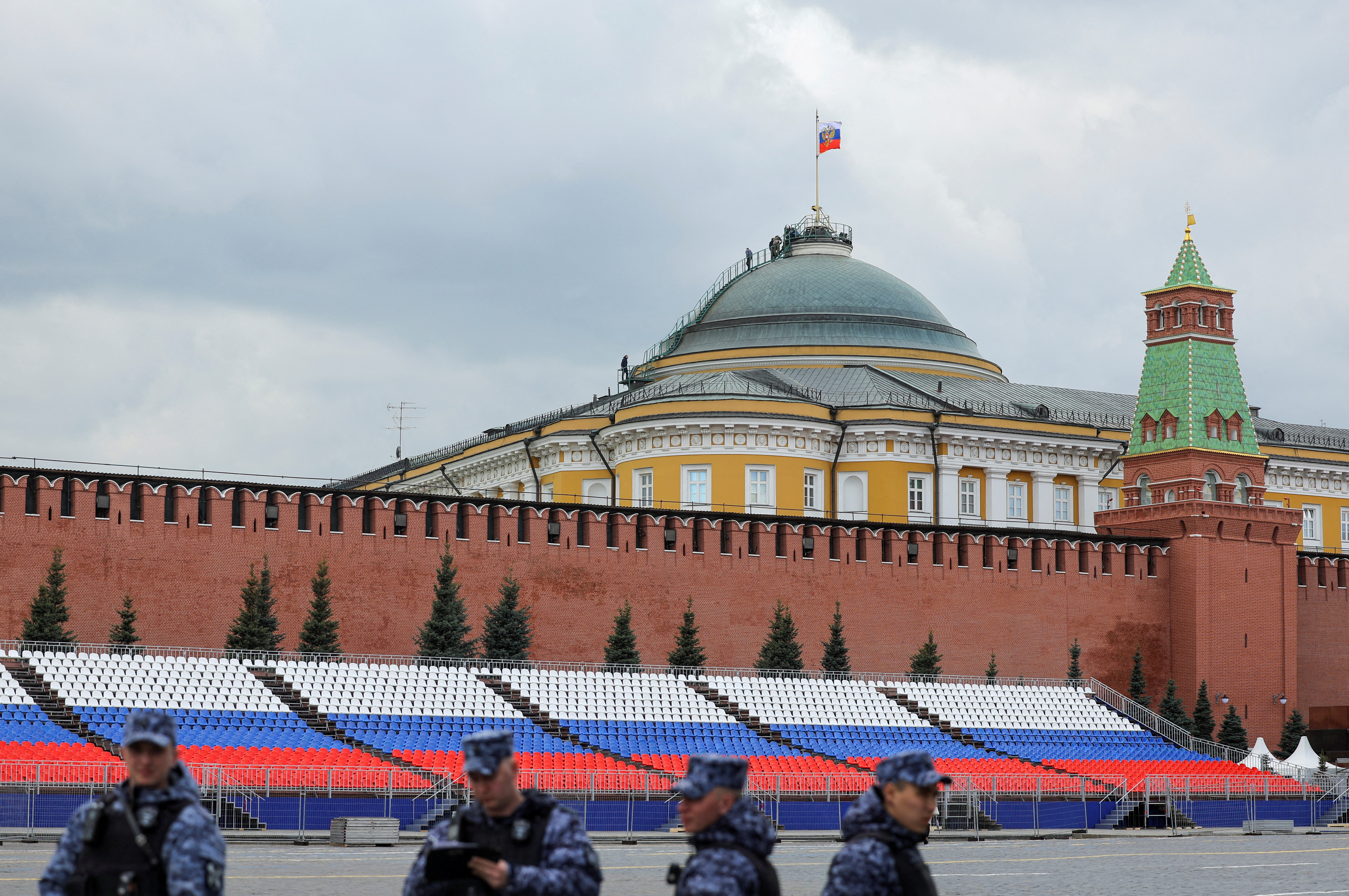 FILE PHOTO: People gather on the dome of the Kremlin Senate building in central Moscow