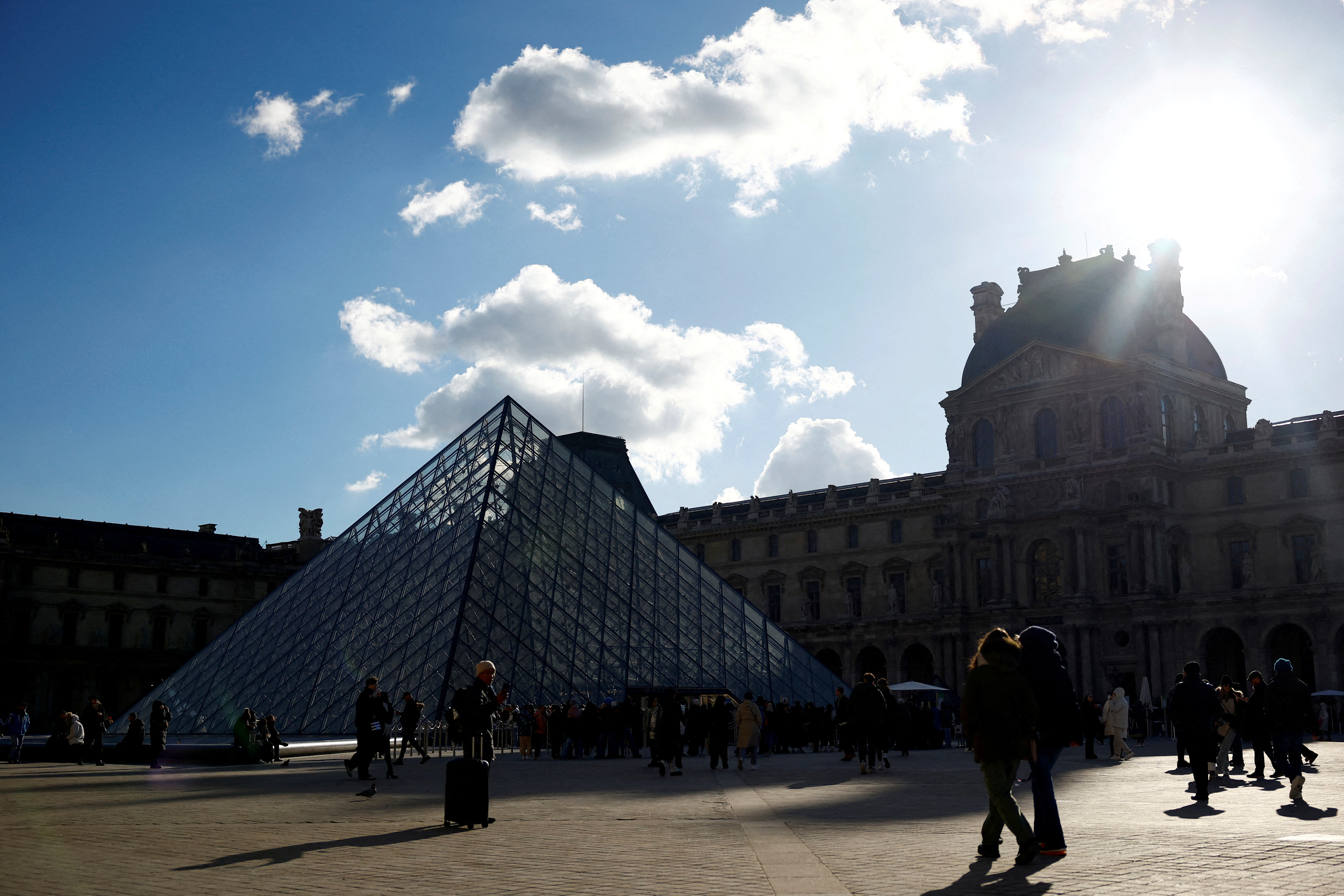 FILE PHOTO: Tourists at the Louvre Museum in Paris