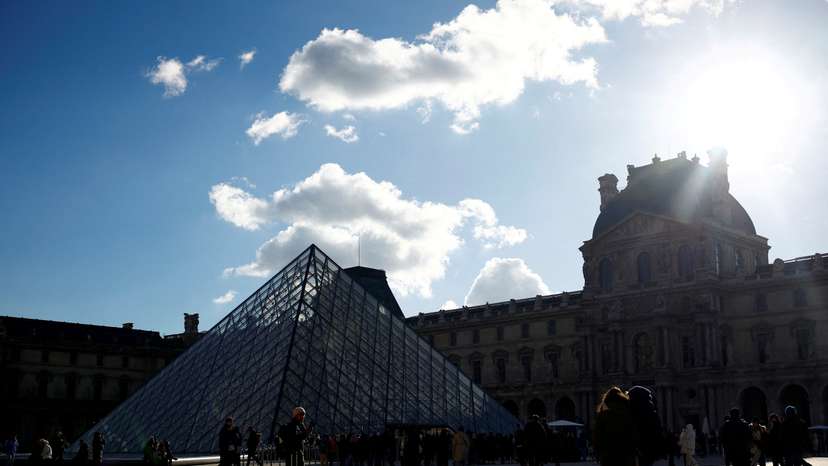 FILE PHOTO: Tourists at the Louvre Museum in Paris