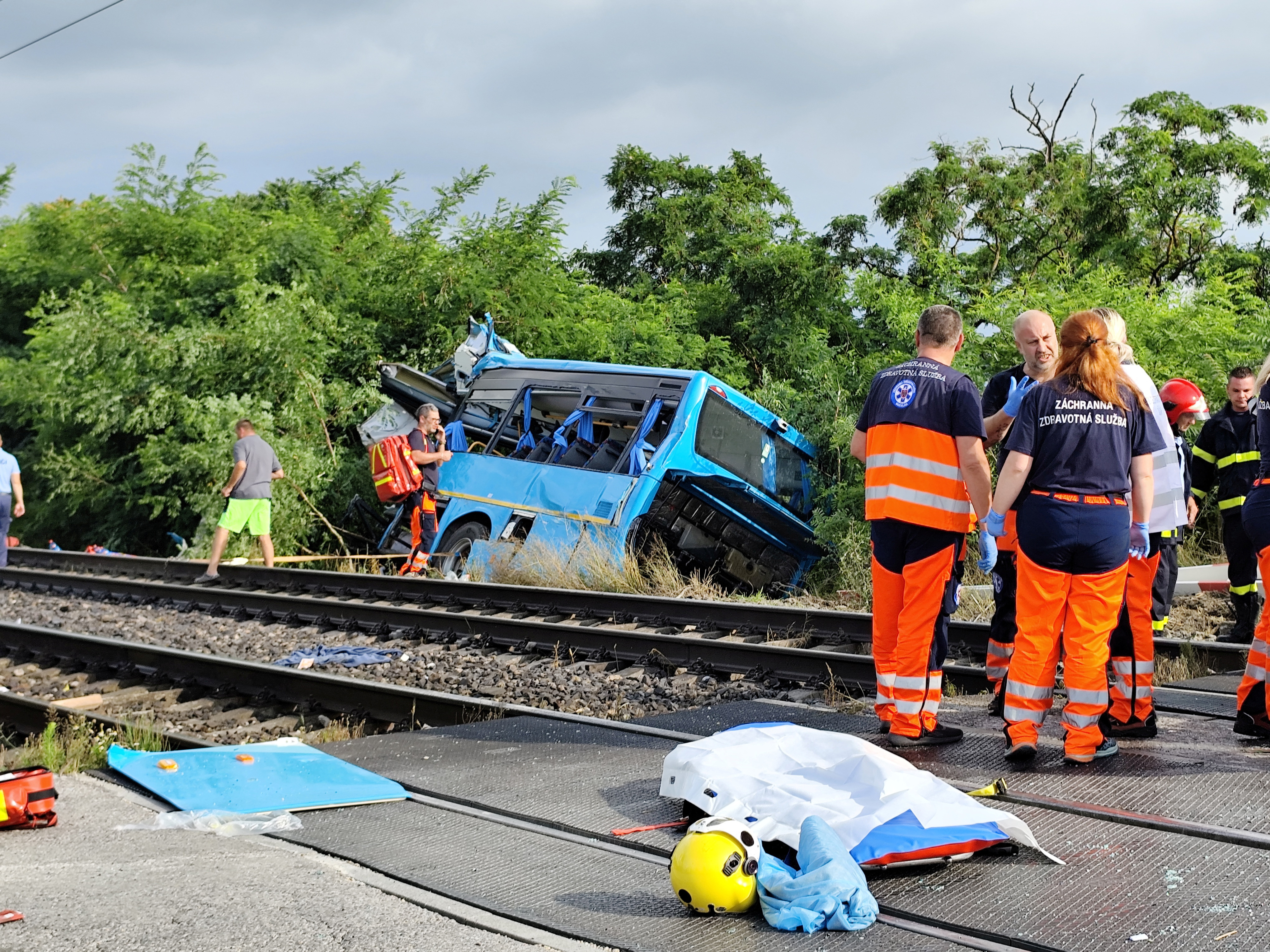Emergency personnel work at the site of a crash near Nove Zamky