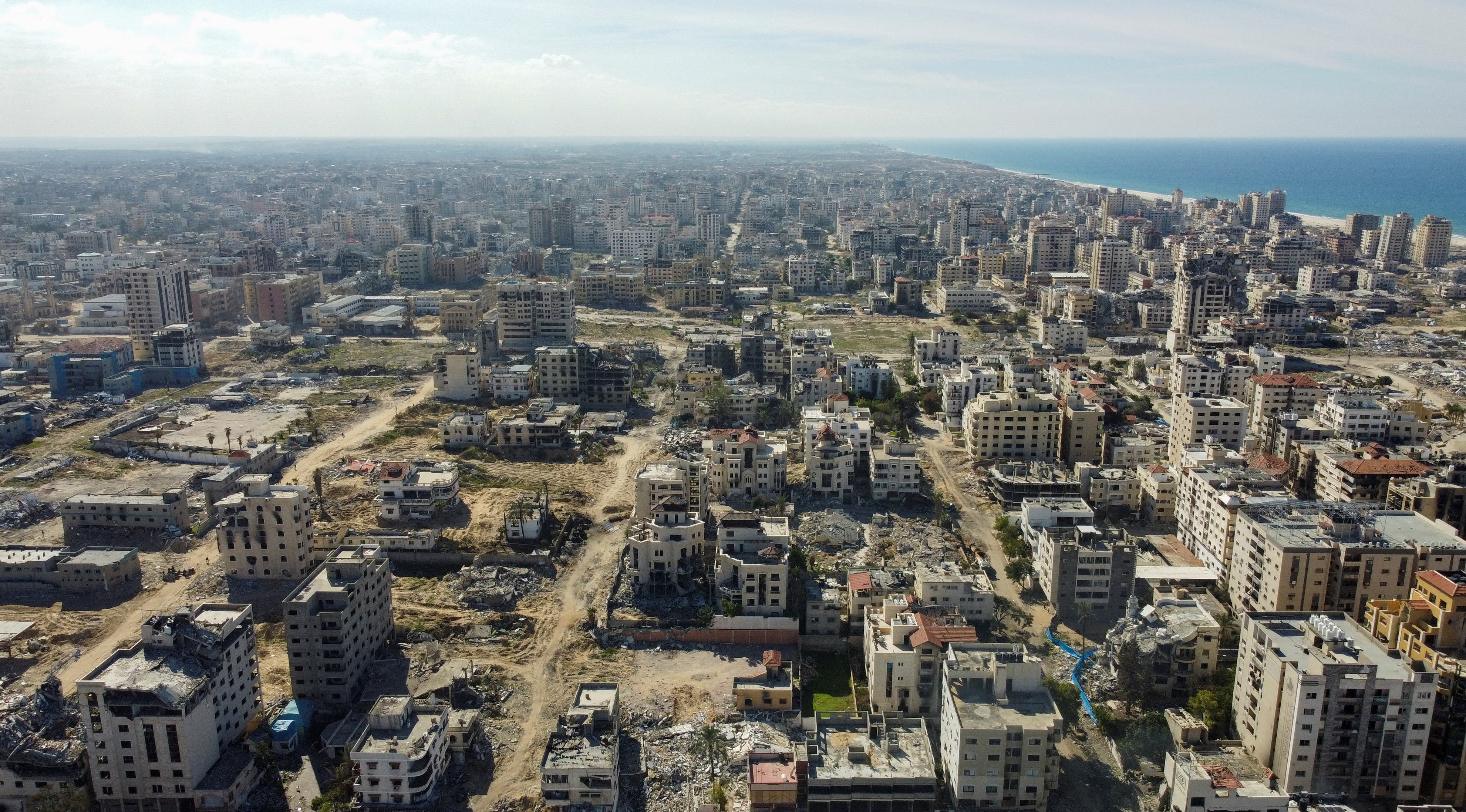 A drone view shows damaged and destroyed buildings, following a ceasefire between Israel and Hamas, in Gaza City