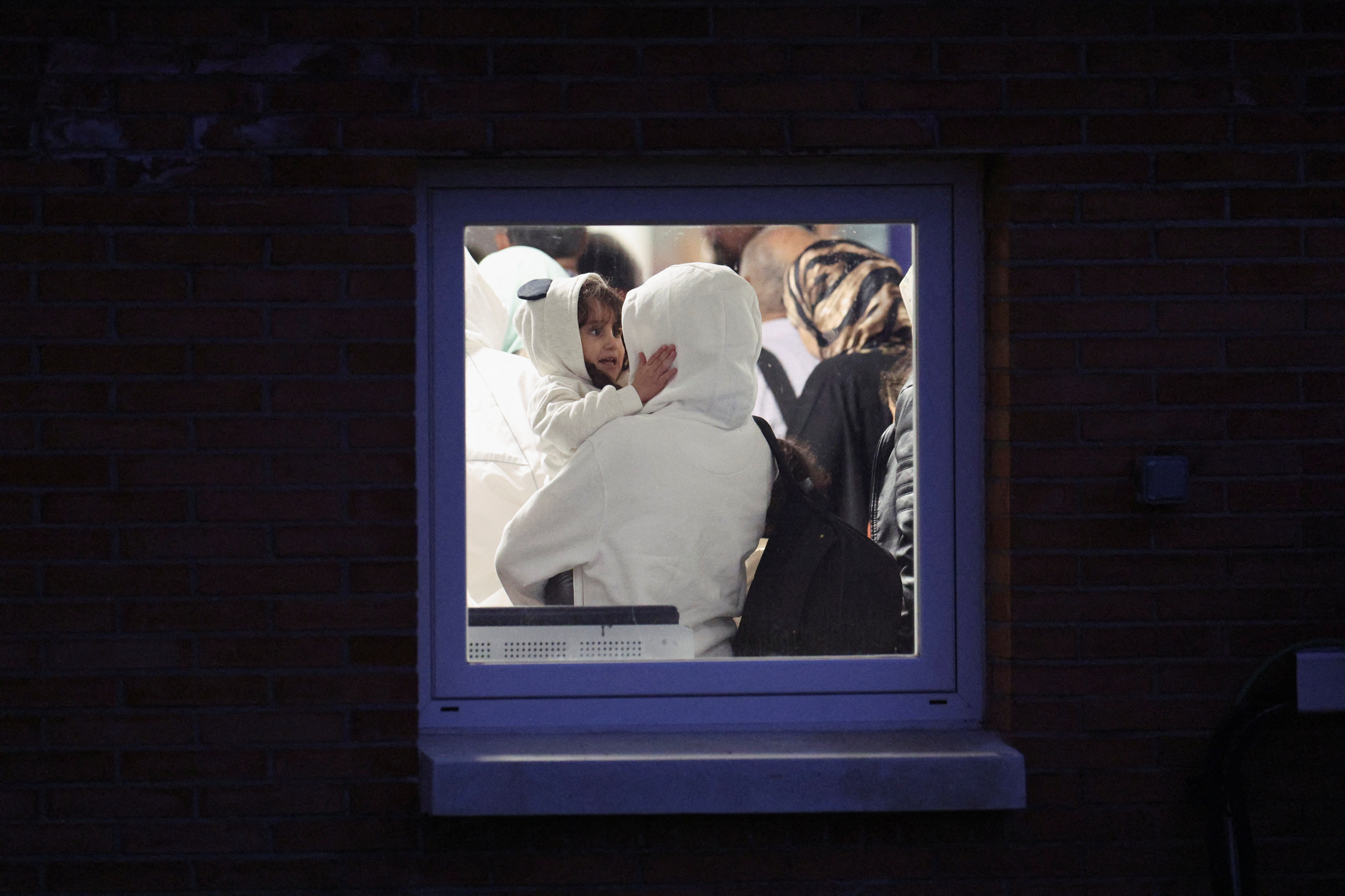 Spanish-Palestinians and Palestinians evacuated from Gaza arrive at a military base outside Madrid