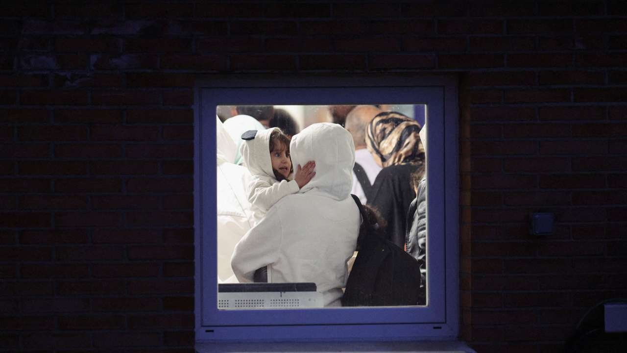 Spanish-Palestinians and Palestinians evacuated from Gaza arrive at a military base outside Madrid