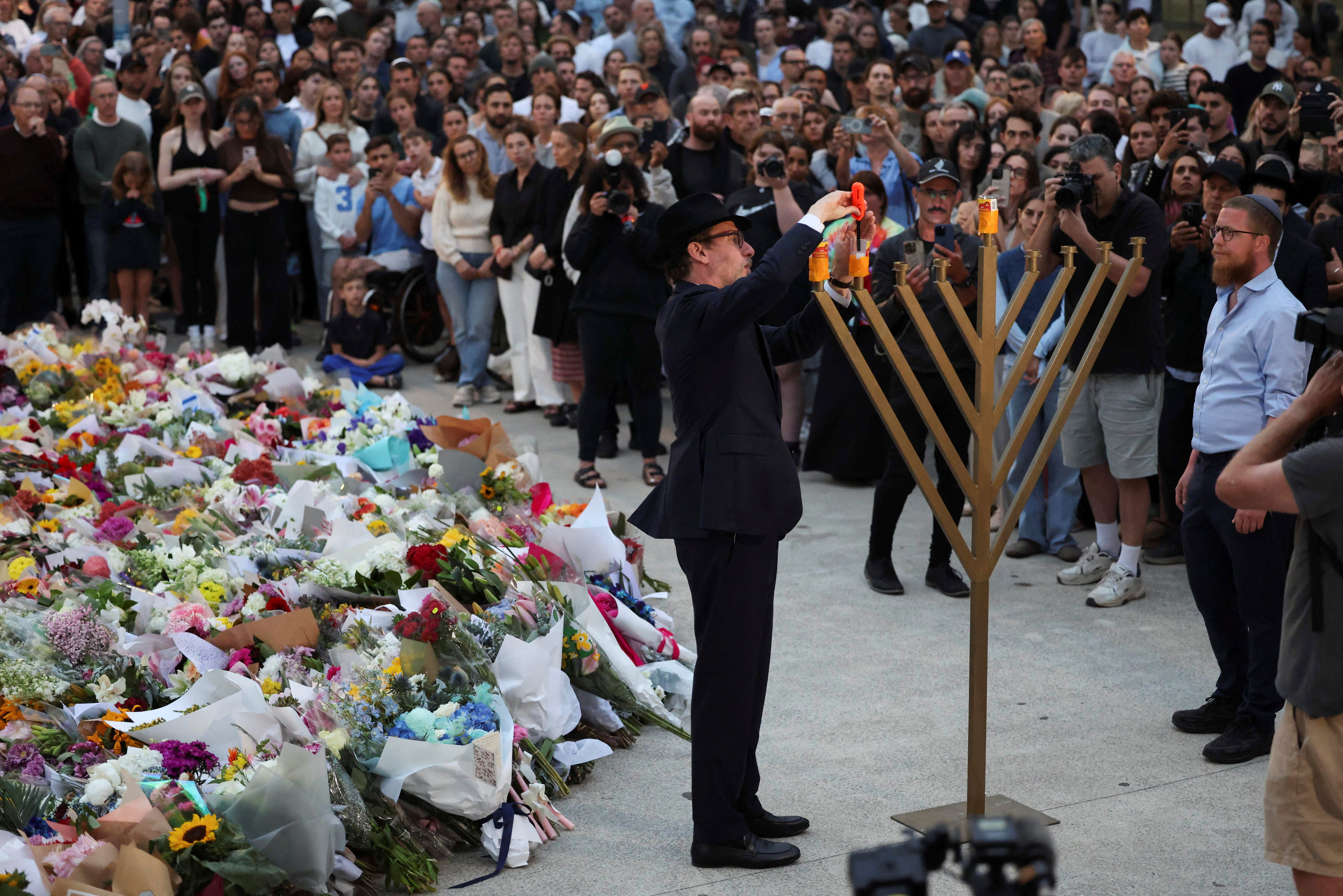 People pay respects at Bondi Pavilion to victims of a shooting during a Jewish holiday celebration at Bondi Beach, in Sydney