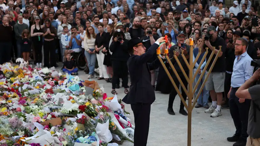 People pay respects at Bondi Pavilion to victims of a shooting during a Jewish holiday celebration at Bondi Beach, in Sydney