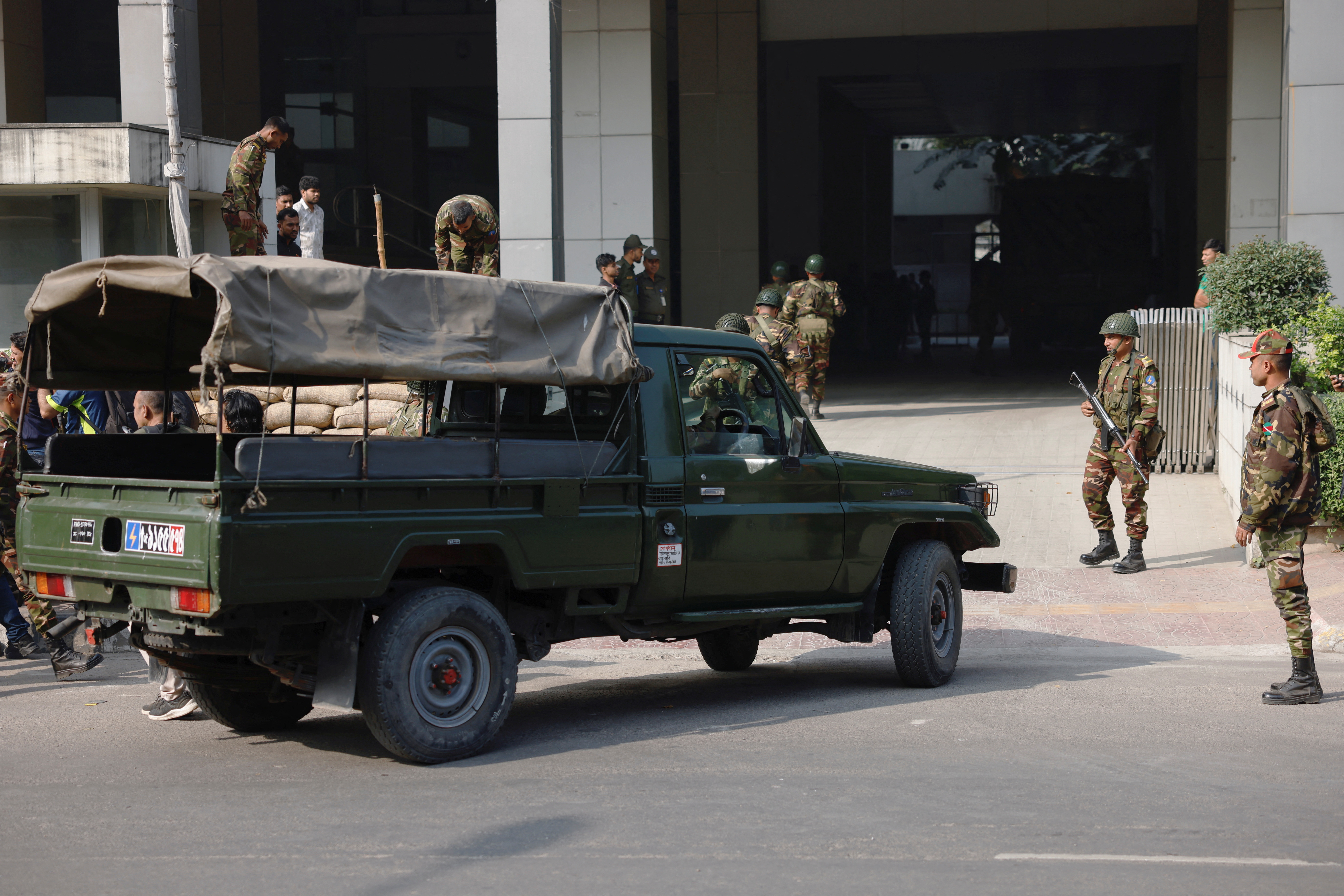 Members of Bangladesh Army arrive at a temporary camp in order to help civil administration during general election in Dhaka