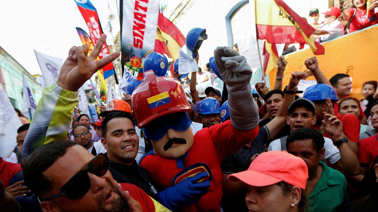 FILE PHOTO: People attend a rally in support of Venezuela's President Maduro, in Caracas