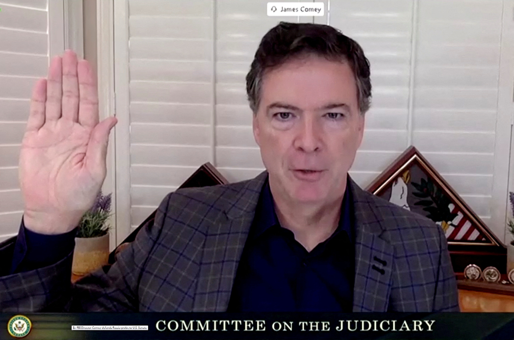 FILE PHOTO: Former FBI Director James Comey testifies before Senate Judiciary Committee in Washington