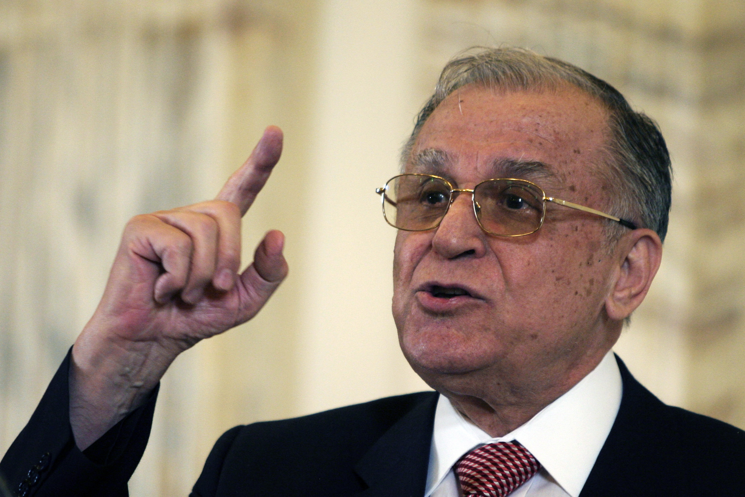 Former Romanian President Iliescu gestures during a meeting with foreign media in Bucharest