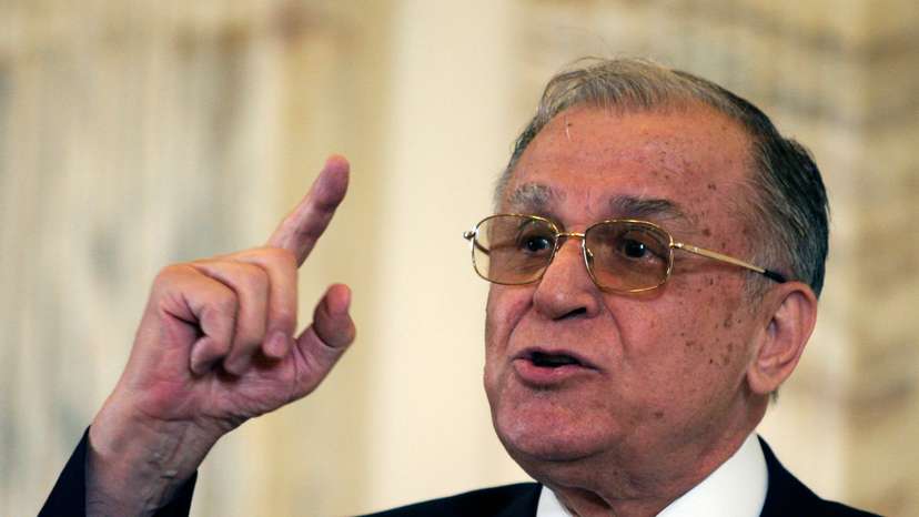 Former Romanian President Iliescu gestures during a meeting with foreign media in Bucharest