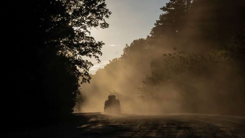 Ukrainian servicemen ride a military vehicle near the Russian border in Sumy region