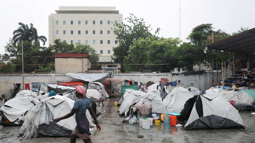 FILE PHOTO: People displaced by gang violence shelter at a school, in Port-au-Prince