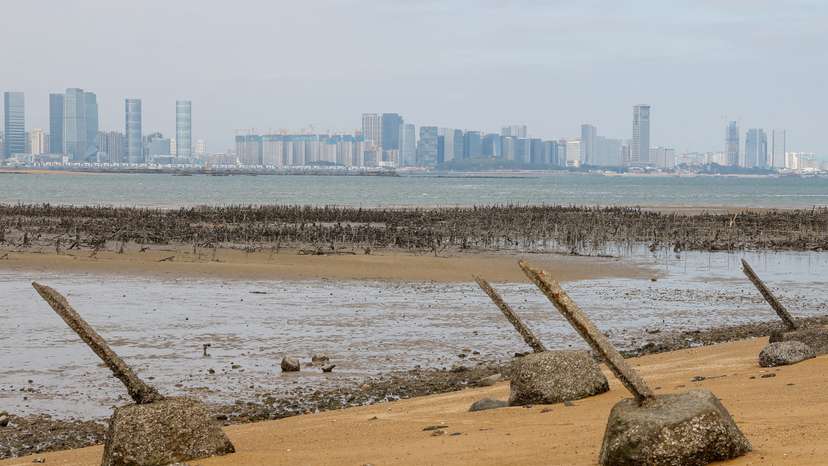FILE PHOTO: Anti-landing barricades are seen on the beach with China's Xiamen in the background in Kinmen