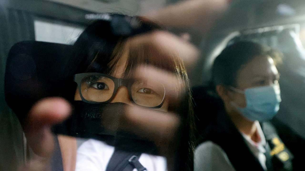 Hong Kong Alliance in Support of Patriotic Democratic Movements of China Vice-Chairwoman Tonyee Chow is seen inside a vehicle after being detained in Hong Kong