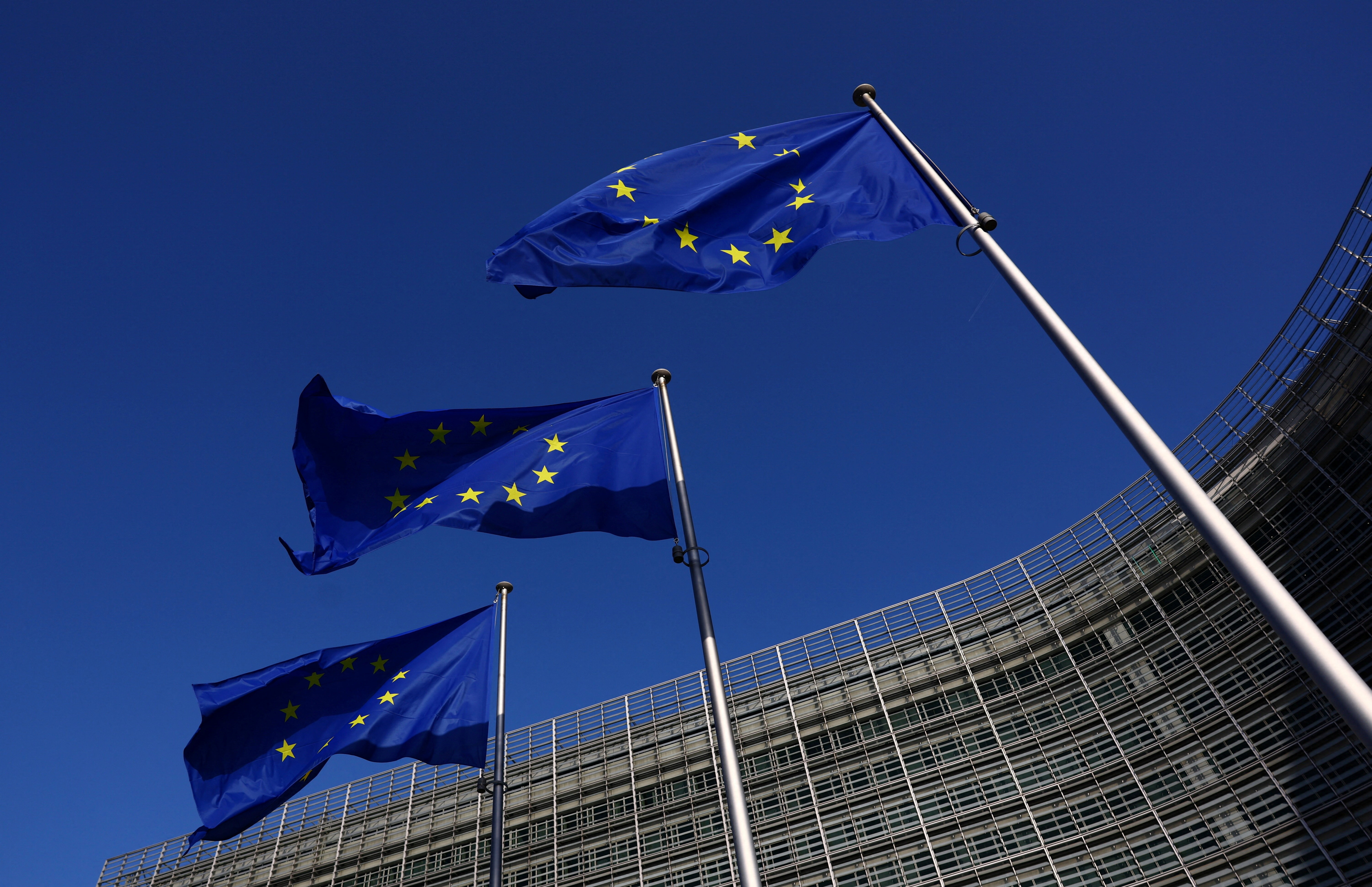 European Union flags flutter outside the European Commission headquarters in Brussels