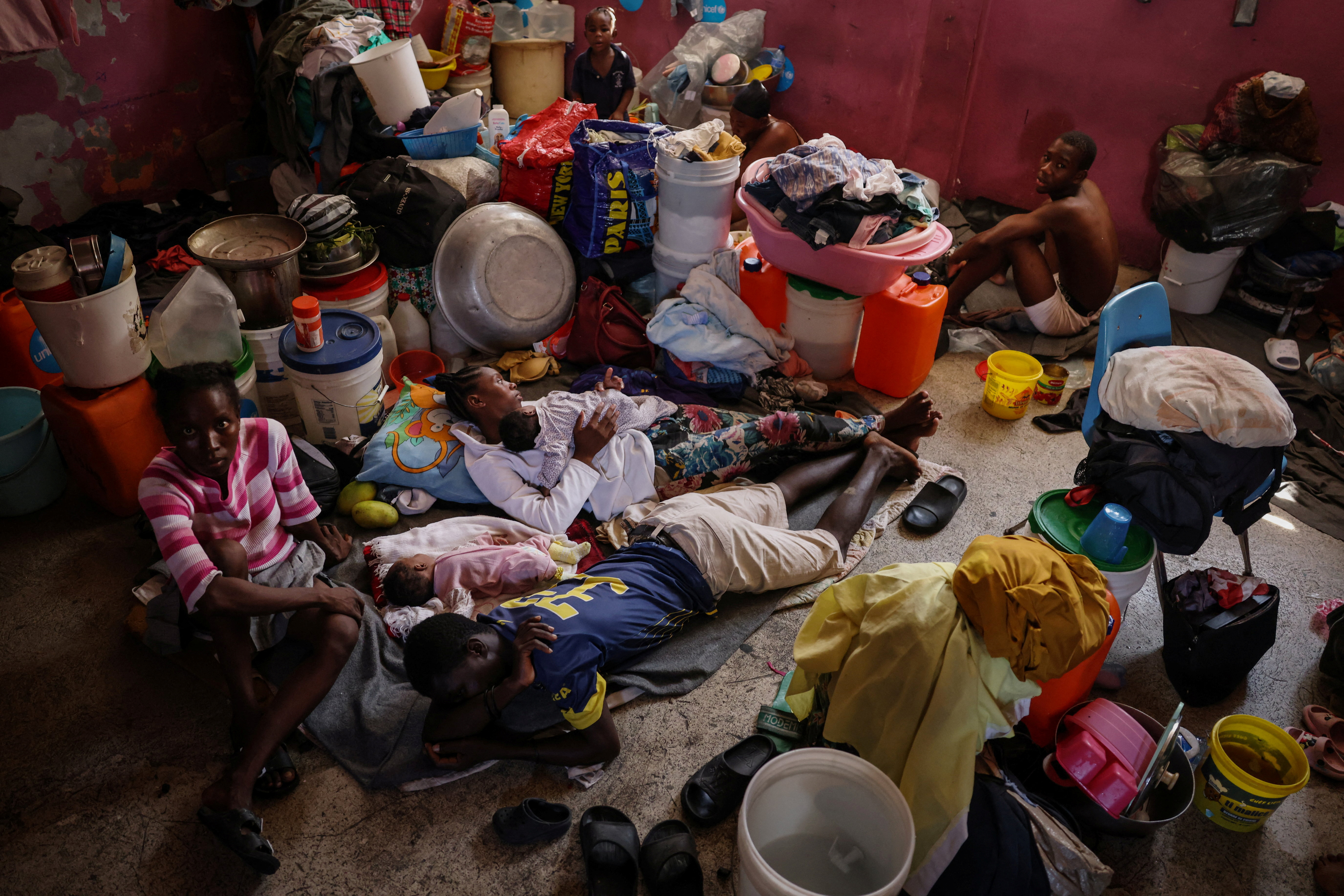 The Wider Image: Camping in schools, hungry Haiti families ask: when will normality return?