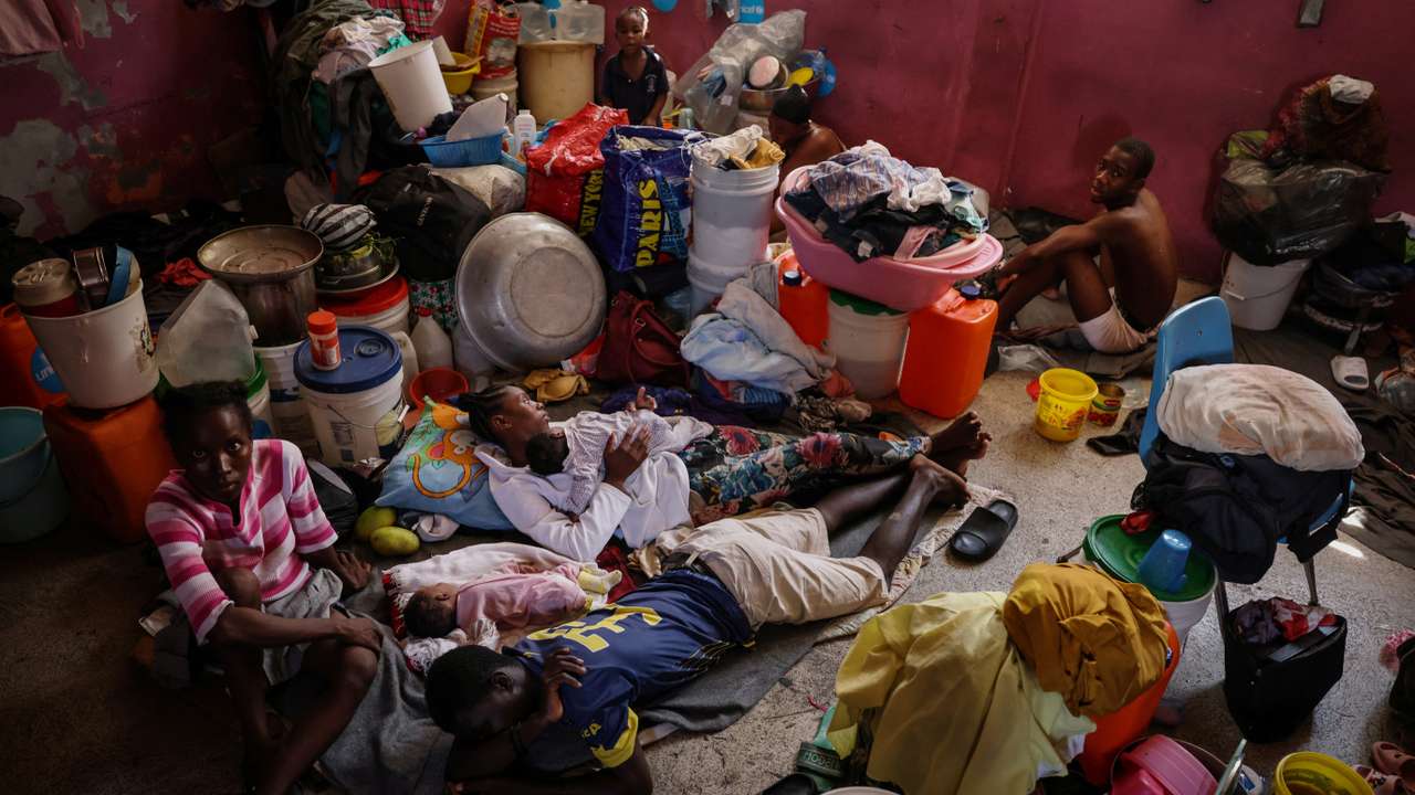 The Wider Image: Camping in schools, hungry Haiti families ask: when will normality return?