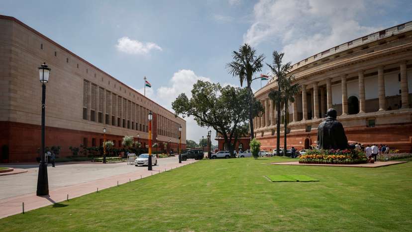 FILE PHOTO: A view shows India's new (L) and old parliament buildings during the first day of the five-day long special session in New Delhi