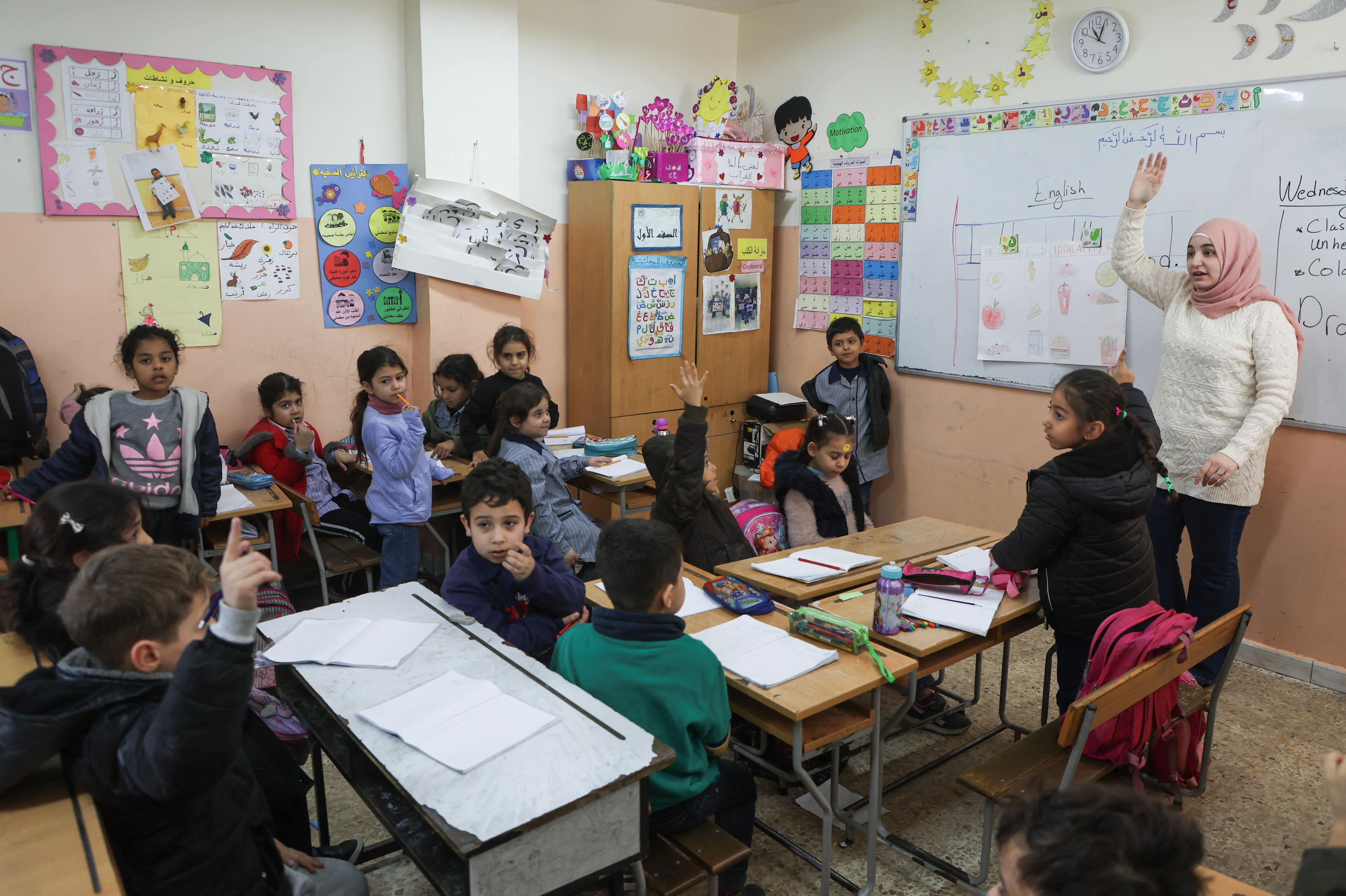 Students attend a class inside a school run by UNRWA at Mar Elias Palestinian refugee camp in Beirut