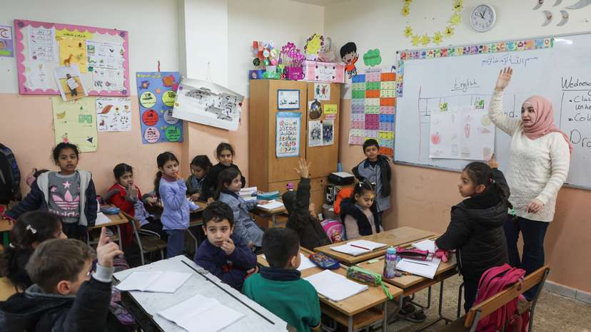 Students attend a class inside a school run by UNRWA at Mar Elias Palestinian refugee camp in Beirut