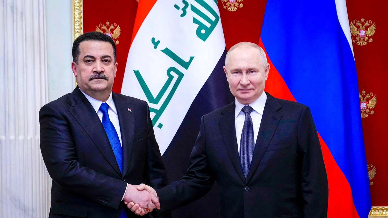 Russian President Vladimir Putin meets with Iraqi Prime Minister Mohammed Shia Al-Sudani during a meeting in Moscow