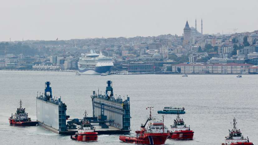 A Russian floating dock is towed by tugboats through Istanbul's Bosphorus to the Black Sea