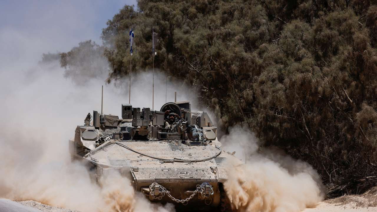 FILE PHOTO: An Israeli military vehicle manoeuvres near the Israel-Gaza border