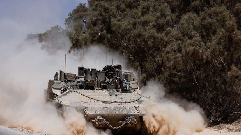 FILE PHOTO: An Israeli military vehicle manoeuvres near the Israel-Gaza border