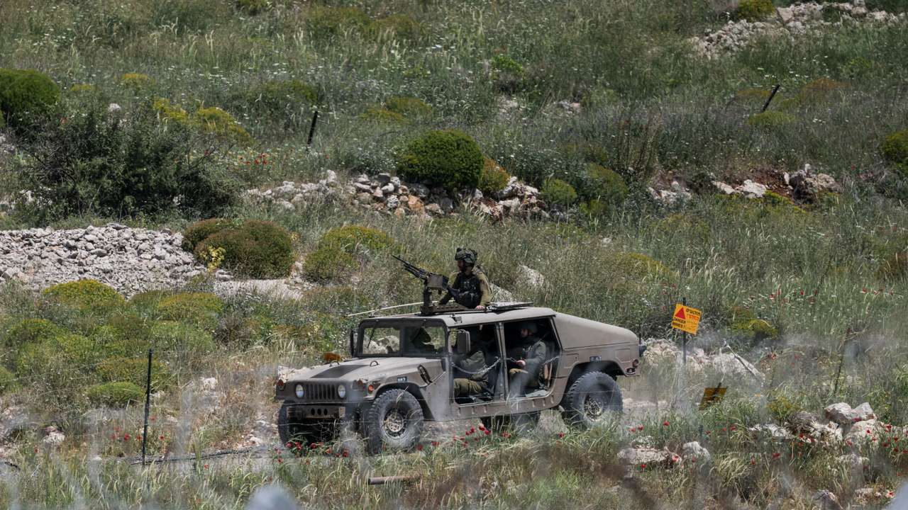 FILE PHOTO: An Israeli military vehicle is seen near the border between the Israeli-occupied Golan Heights and Syria