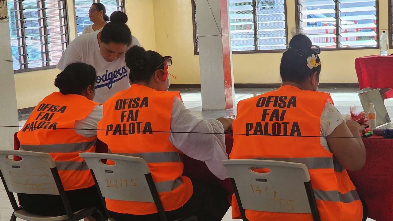 Election officials work on the day of the general elections, in Funafuti
