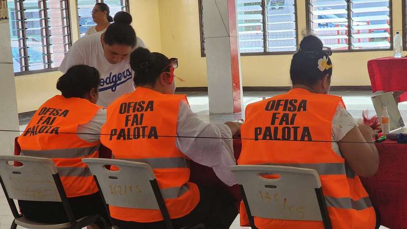Election officials work on the day of the general elections, in Funafuti