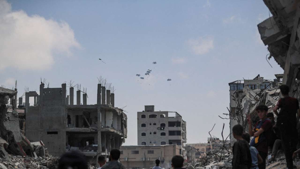 FILE PHOTO: Aid packages are airdropped over Gaza, as seen from Gaza City