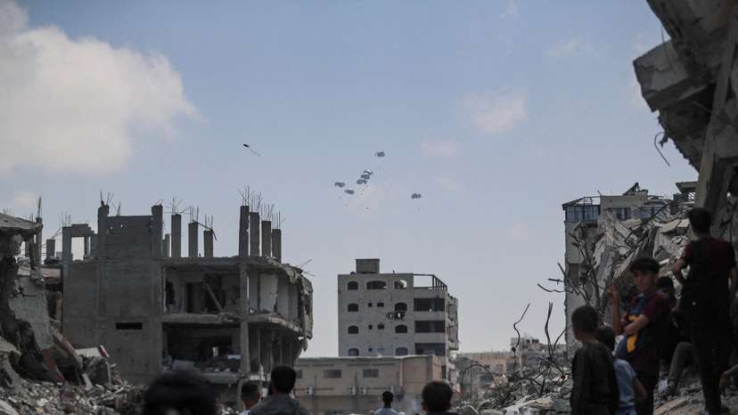 FILE PHOTO: Aid packages are airdropped over Gaza, as seen from Gaza City