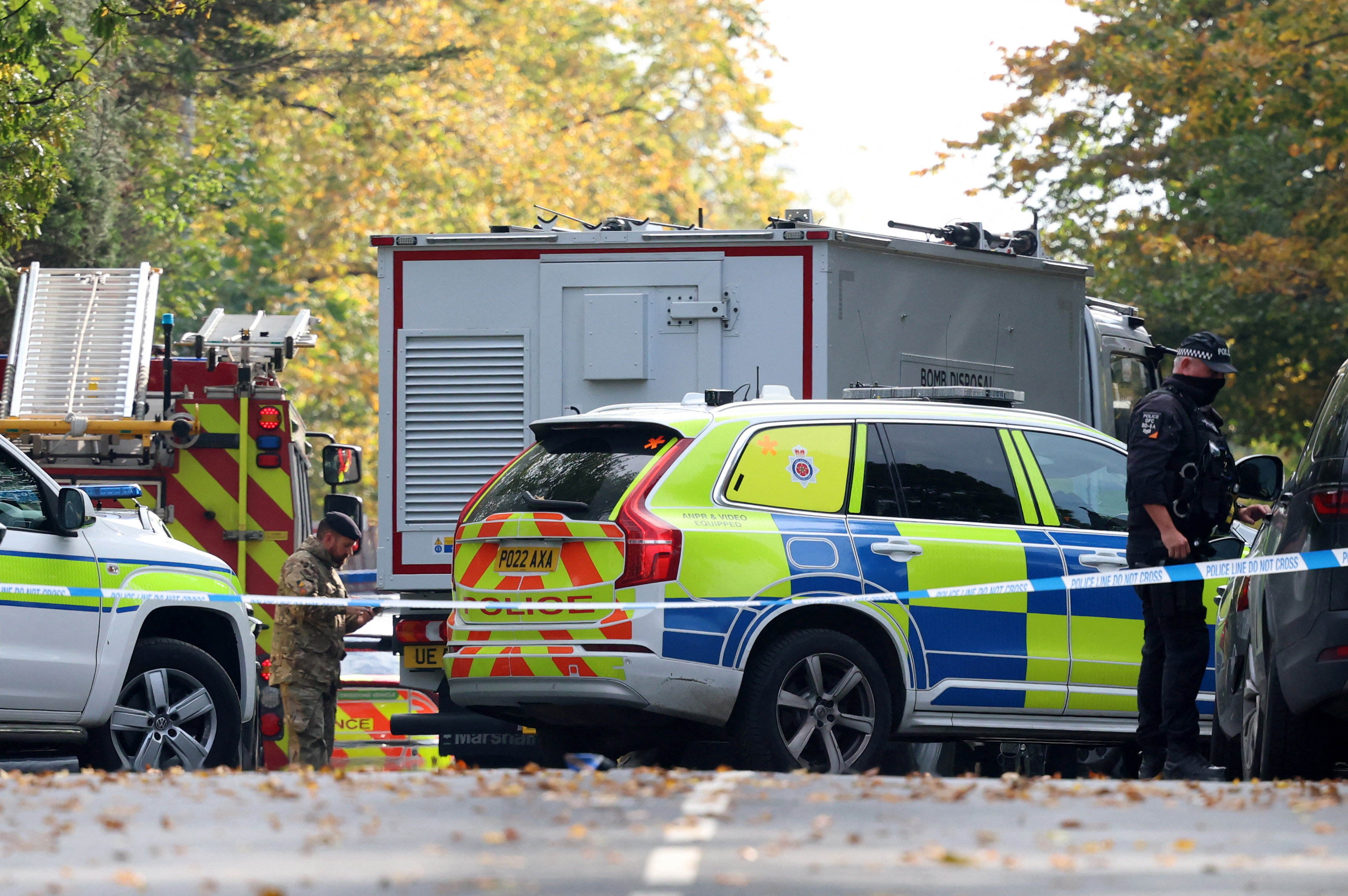 Emergency personnel work at the scene following an incident outside a synagogue, in Manchester