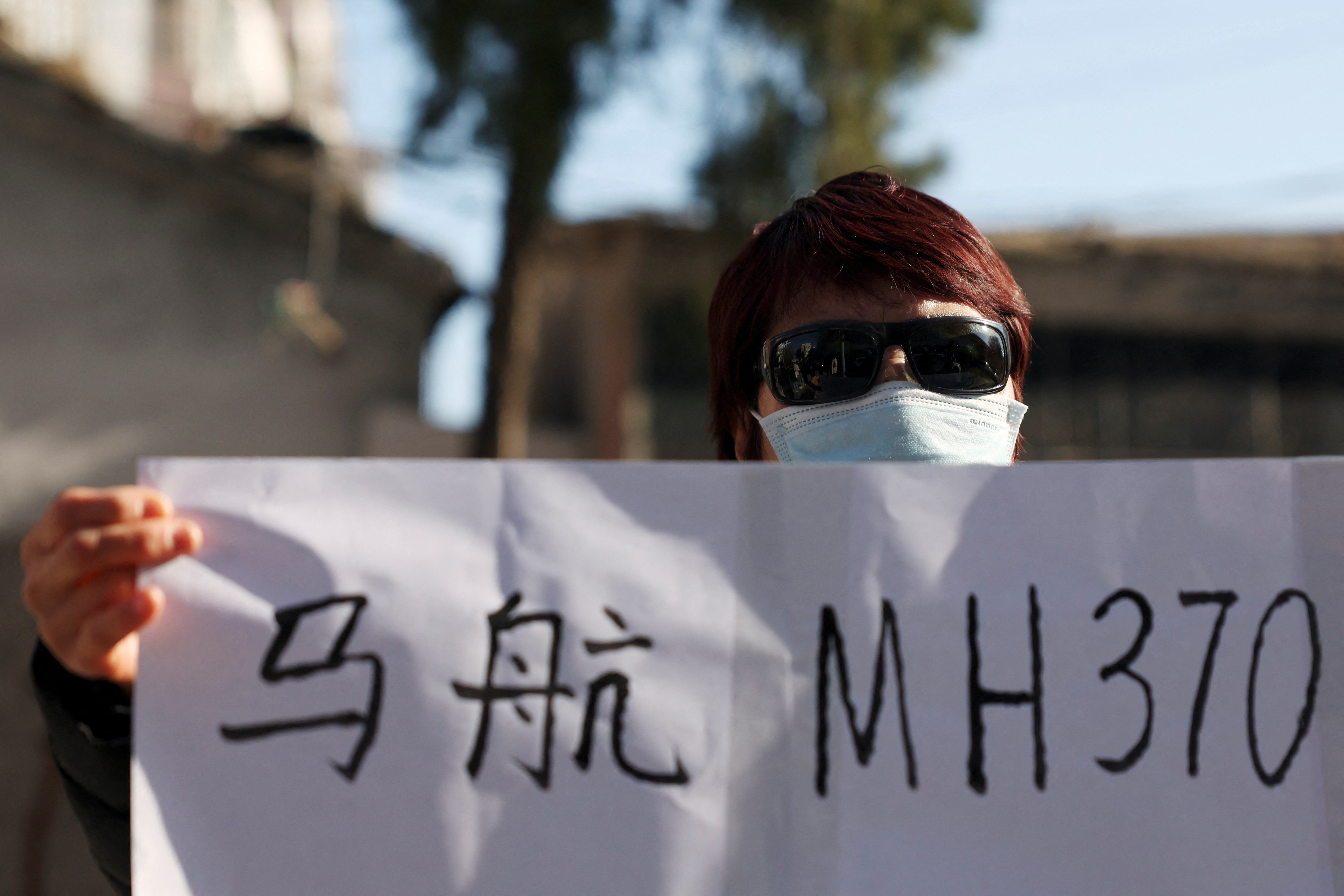 Family members of passengers on Malaysia Airlines flight MH370 that went missing in 2014, in Beijing