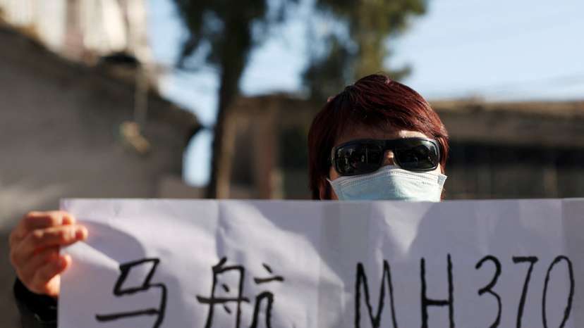 Family members of passengers on Malaysia Airlines flight MH370 that went missing in 2014, in Beijing