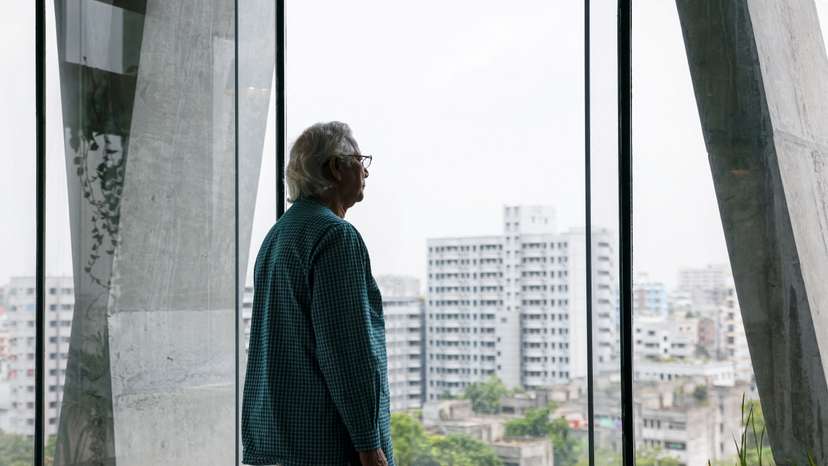 Bangladeshi Nobel Peace Prize winner Dr. Muhammad Yunus looks on as he poses for photo during an interview with Reuters in his office, in Dhaka