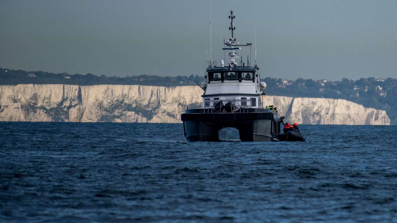 FILE PHOTO: Migrants cross the English Channel in small boats