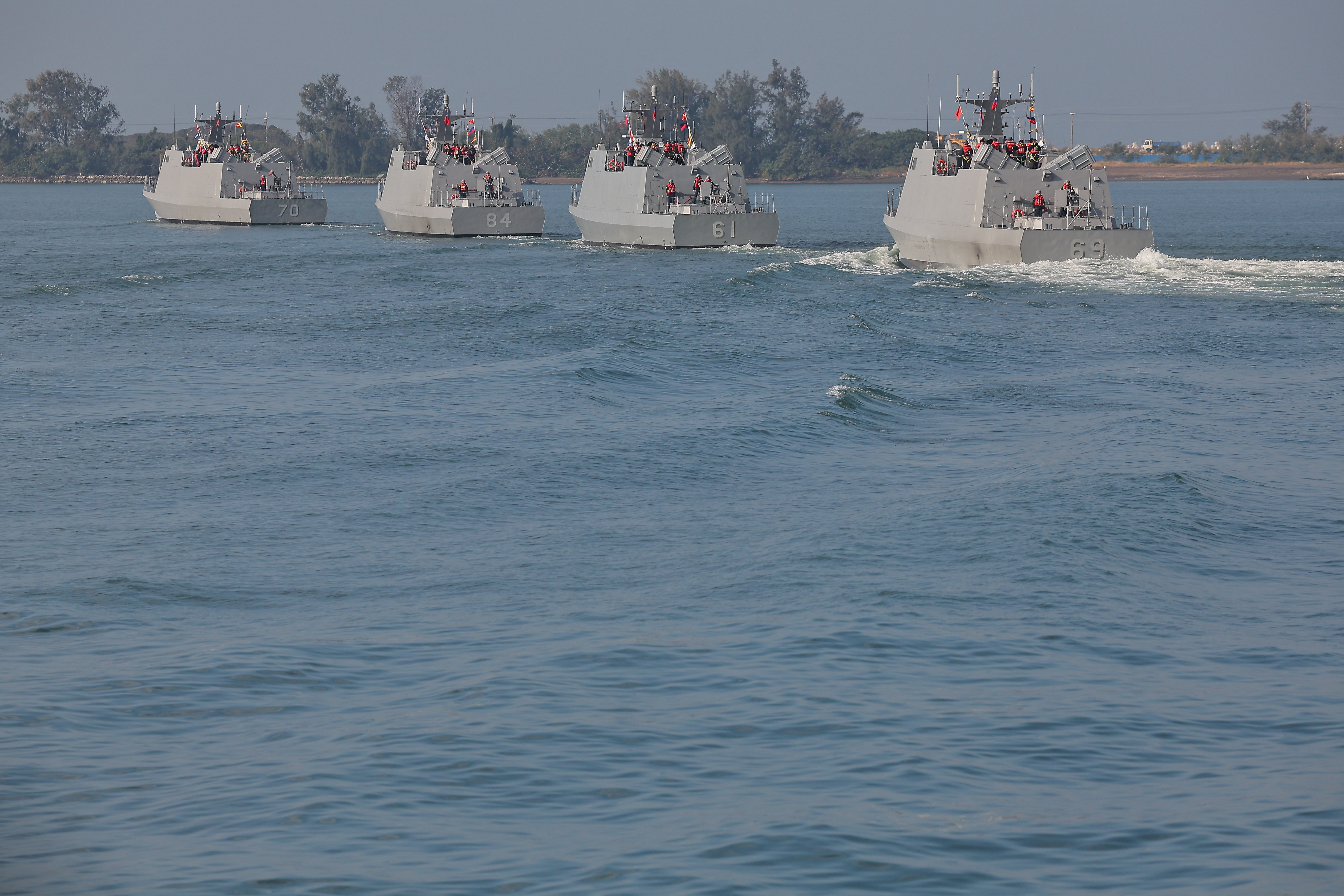 Navy personnel and members of the media sail on board the Kuang Hua VI-class missile boat as the Taiwan military demonstrates combat readiness ahead of the upcoming Lunar New Year
