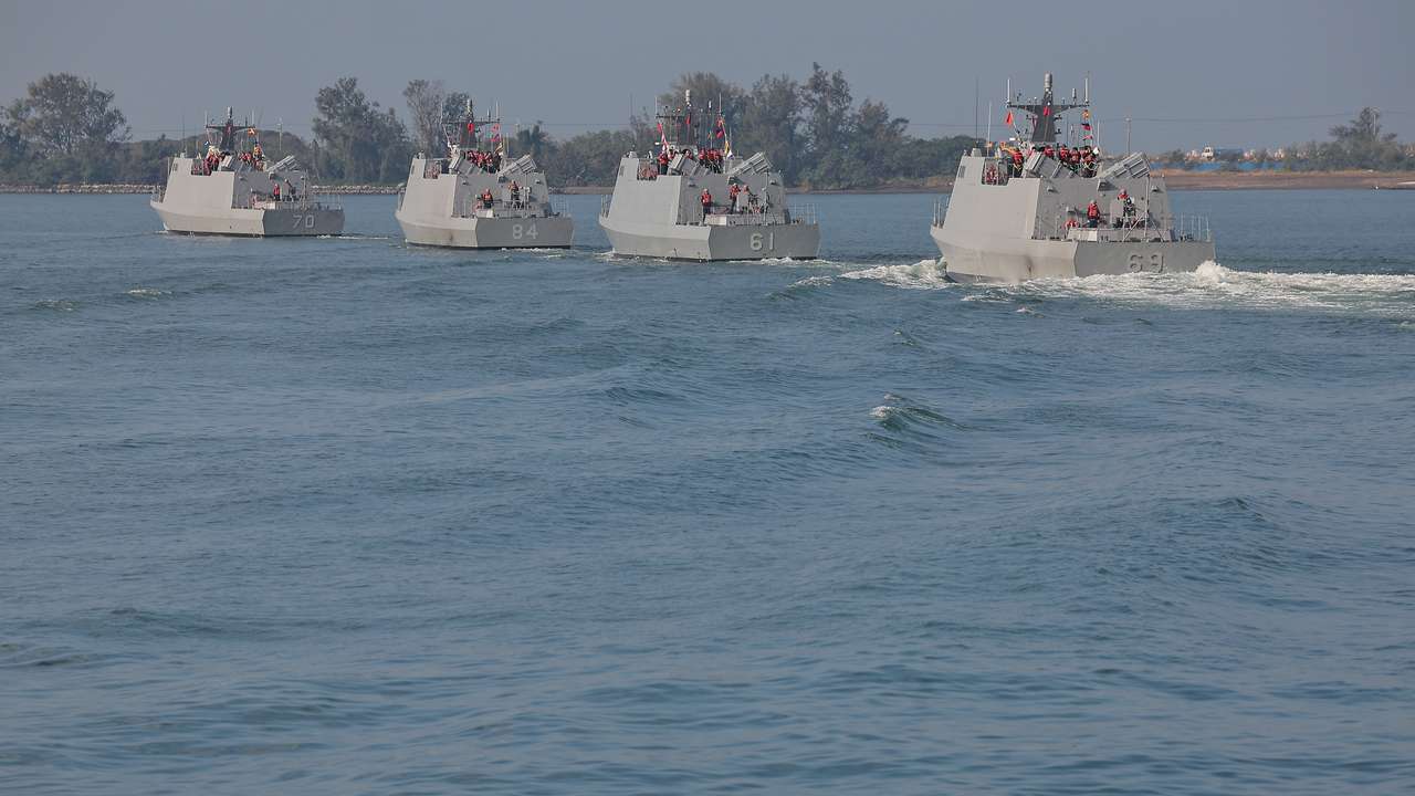 Navy personnel and members of the media sail on board the Kuang Hua VI-class missile boat as the Taiwan military demonstrates combat readiness ahead of the upcoming Lunar New Year