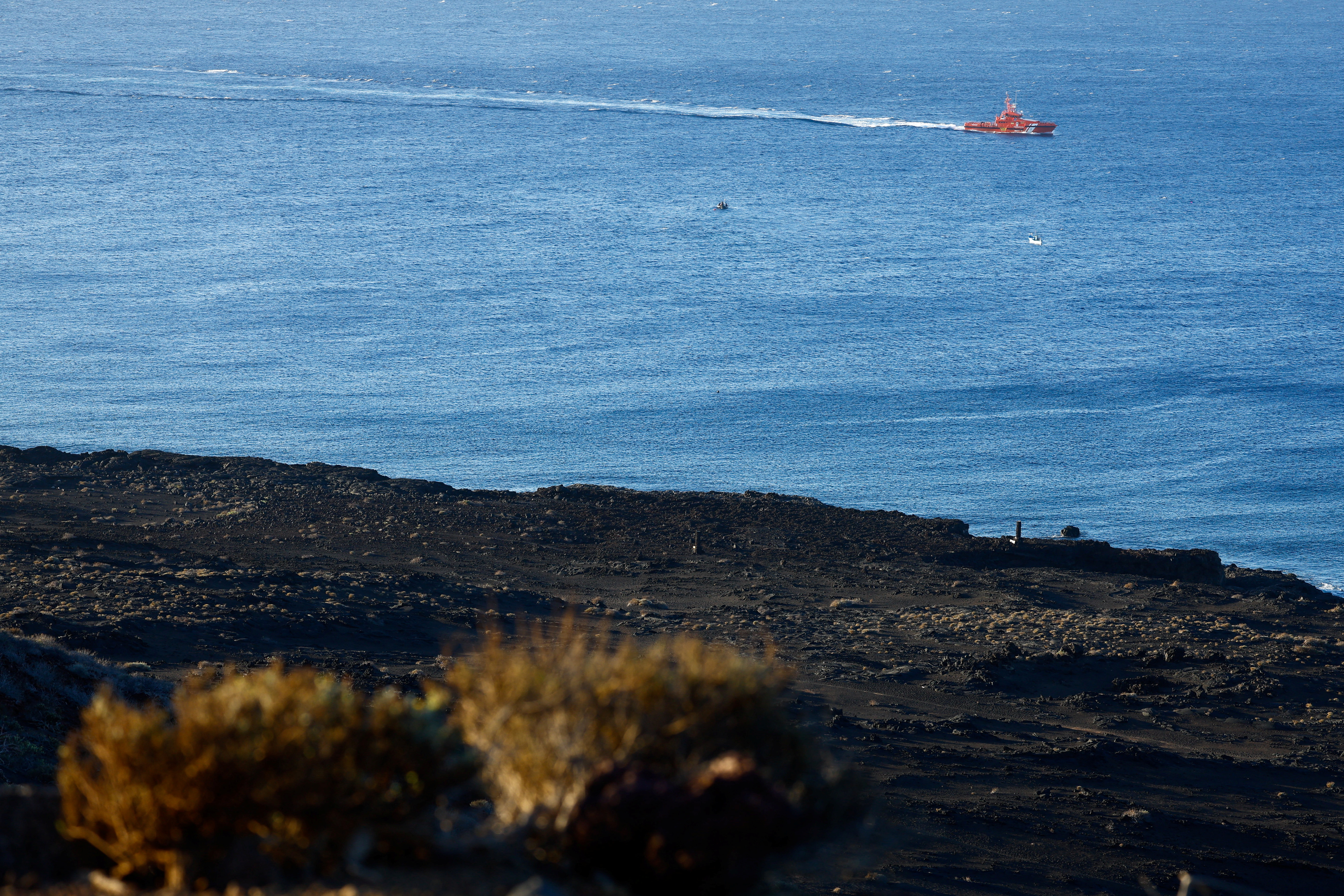 A maritime rescue boat searches for possible survivors after the sinking of a wooden boat with migrants near the port of La Restinga, on the island of El Hierro